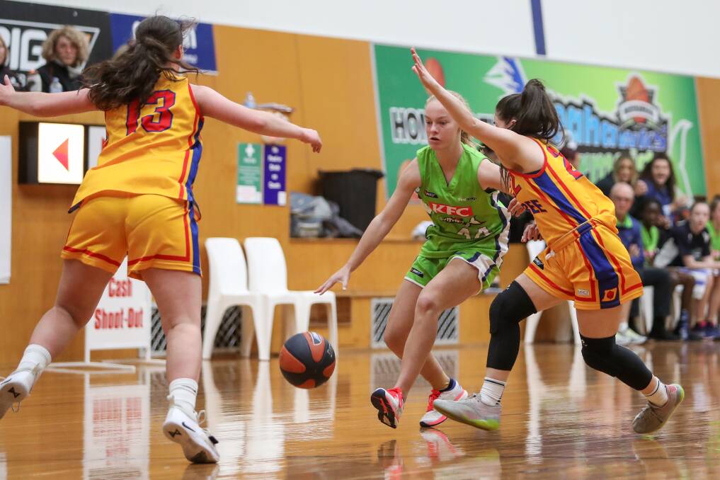 YOUNGSTER: Warrnambool's Ava Bishop drives the ball forward during the Mermaids' loss to Werribee Devils on Saturday night. Picture: Morgan Hancock