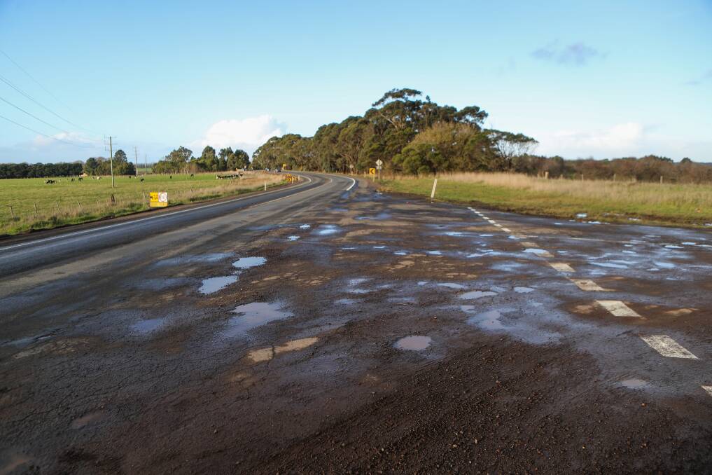 BUMPY RIDE: There are dozens of potholes on the Princes Highway west of Garvoc where a workers laid a temporary seal after not completing works before winter. Picture: Morgan Hancock