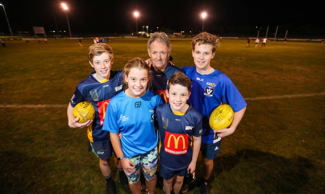 FAMILY TIME: Dad Wayne Bellman with children (back) Ryan, 13, and Nick, 17, and (front) Alana, 16, and Sam, 11, at Warrnambool and District Football Umpires Association training on Wednesday night. Picture: Morgan Hancock