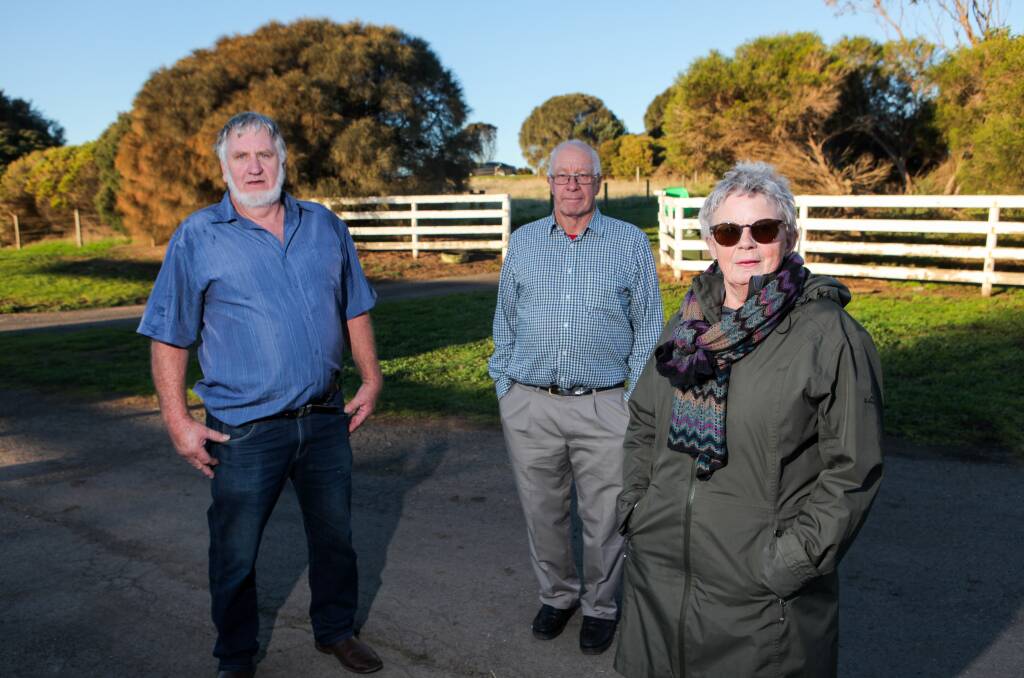 LIVING IN FEAR: David Potter, Bernard Rooney and Dorothy Rooney are concerned about the impacts on neighbours of The Lookout being built at Dennington. Picture: Rob Gunstone