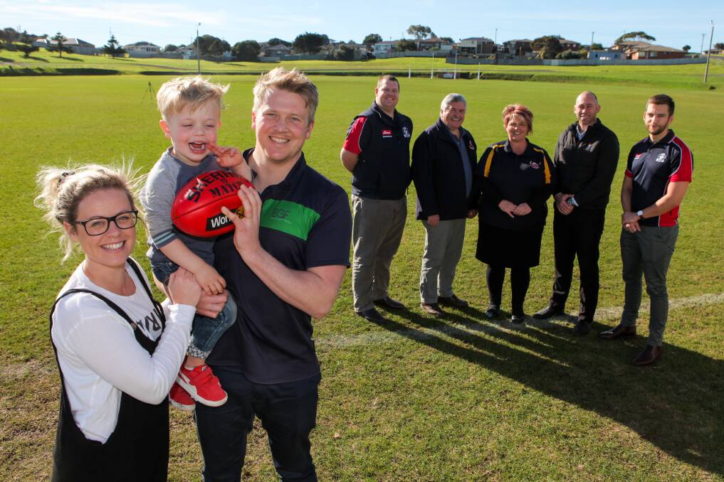 Kristy Dowie, Noah Dowie, 4, and Jet Dowie receive a cheque from Brad Pole, AFL Western District, Michael Harrison, Kylie Murphy and Billy Edis, WDFNL board, and Mat Milne, AFL Western District, to help fund a trip to the US. Picture: Rob Gunstone