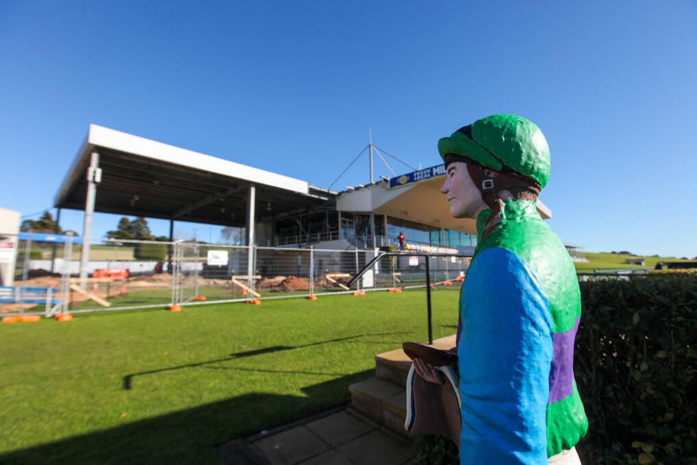 Off and building: The Grand Annual jockey statue watches the construction site at the Warrnambool Racing Club. Pictures: Rob Gunstone