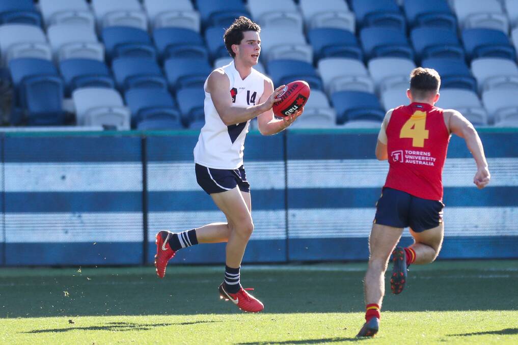 SMOOTH MOVER: South Warrnambool's Liam Herbert takes possession of the ball for Vic Country against South Australia in the AFL under 18 championships in Geelong on Friday. Picture: Morgan Hancock