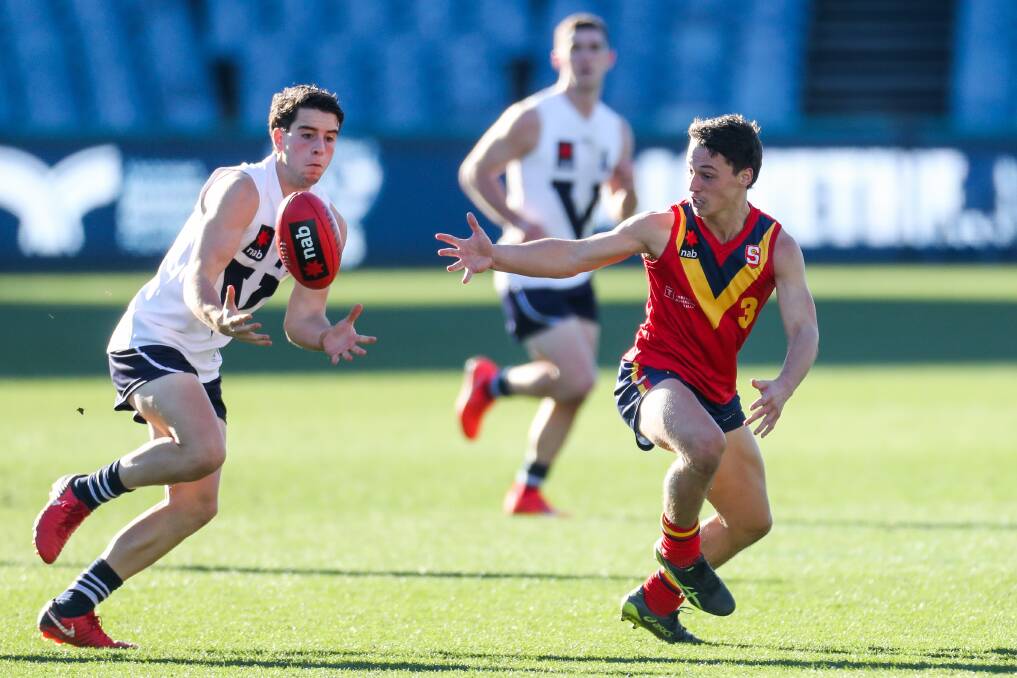IT'S MINE: Vic Country's Liam Herbert and South Australia's Corey Durdin both reach for the ball during Friday's clash at Geelong's GMHBA Stadium. Picture: Morgan Hancock