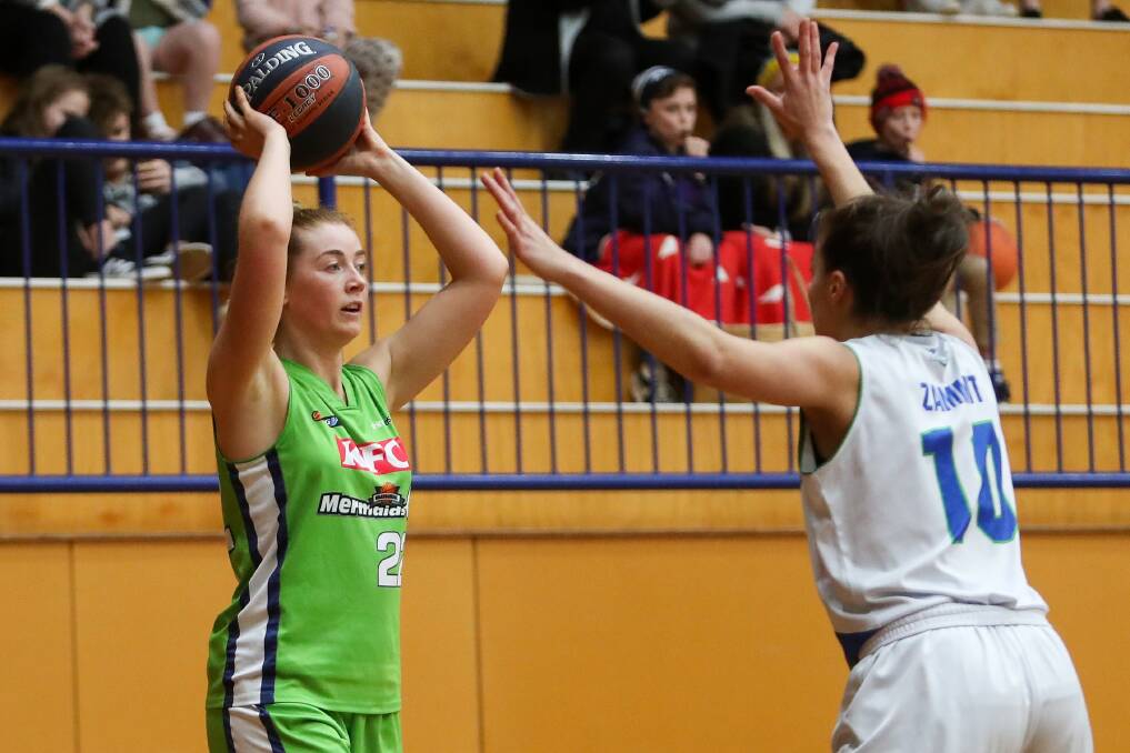 Assessing options: Lily Killey throws the ball in against the Hume City Broncos on Saturday night. Picture: Morgan Hancock