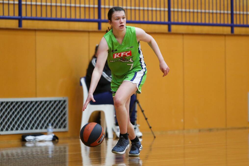 Honoured: Warrnambool Mermaids utility Leah Bartlett moves the ball up court. Picture: Morgan Hancock