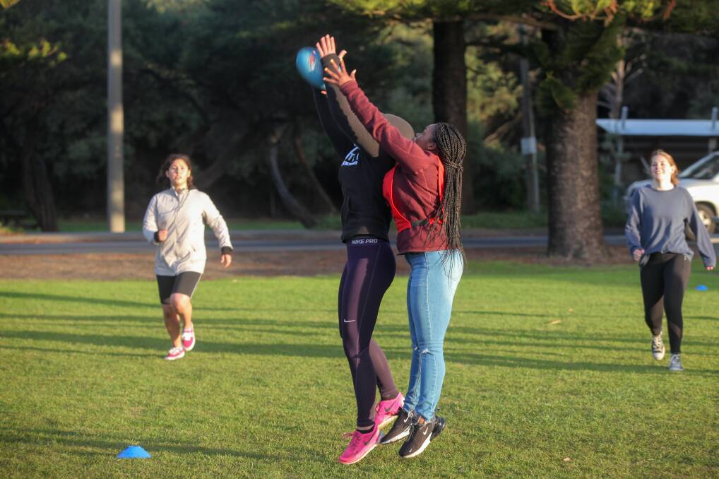 AFL: Deakin University's new international students enjoy the sunshine with an introduction to Aussie Rules football. Picture: Rob Gunstone