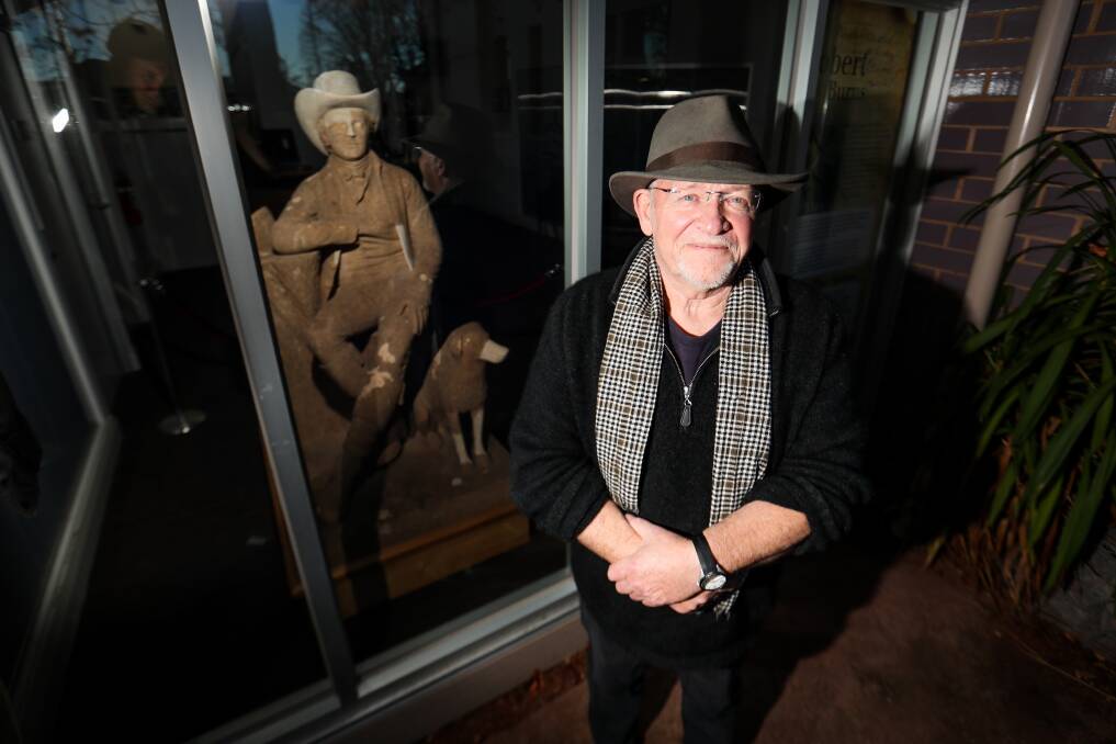 BURNS FAN: Eric Bogle poses next to the Robert Burns statue. Picture: Morgan Hancock