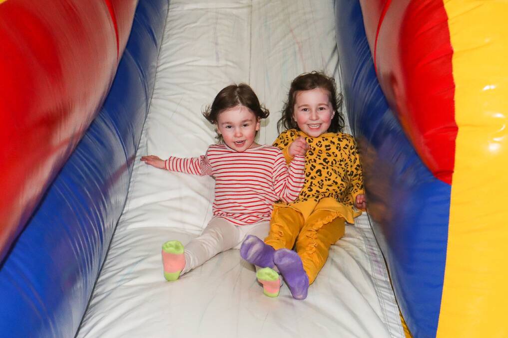 'The best': Georgia Perry, 3, and Elise Perry, 5, rush down their favourite slide. Picture: Morgan Hancock