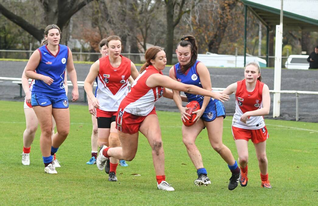 Under pressure: South Warrnambool's Laura De Bolfo and Horsham Demons' Kate McLean in a contest. Picture: Jade Bate