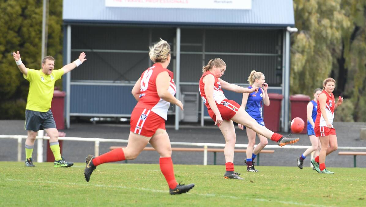 ON DEBUT: South Warrnambool's Kelsey Perry gets a quick kick away against Horsham Demons on Sunday. Picture: Jade Bate