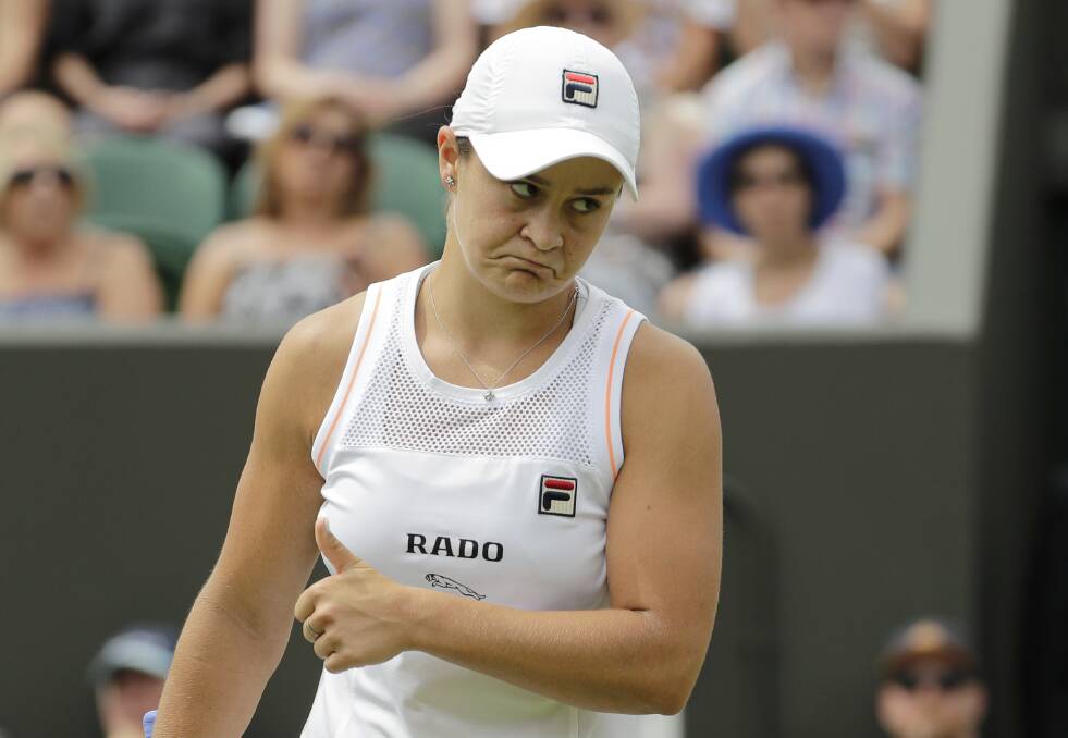 Out: Australia's Ash Barty gestures after missing a point in a women's singles match against United States' Alison Riske during day seven of the Wimbledon Tennis Championships in London. Picture: Ben Curtis