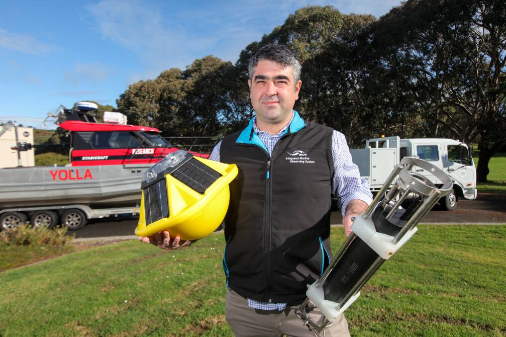 New research: Deakin University Associate Professor Daniel Ierodiaconou with a wave bouy and one of the the VIMOS conductivity temperature depth recorders. Picture: Rob Gunstone