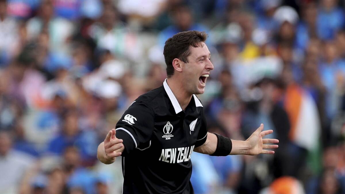 Shock win: New Zealand's Matt Henry celebrates the dismissal of India's Dinesh Karthik during the Cricket World Cup semi-final between India and New Zealand at Old Trafford in Manchester overnight.
