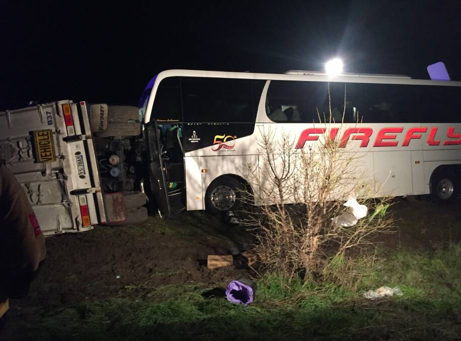 A bus driver has died and at least eight passengers were injured when their bus crashed into a truck trailer that was blocking the Western Highway in both directions.
The early morning crash at Pimpinio happened about 2am. Picture: Nine News