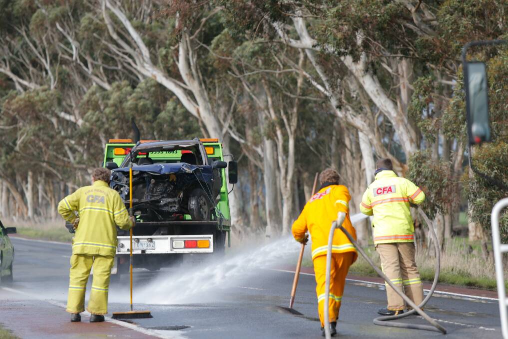 The crashed car is towed away on the Princes Freeway near Boorcan. Picture: Mark Witte