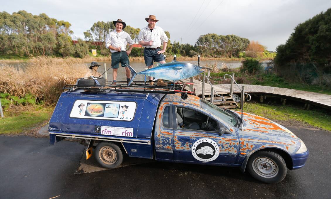 Long Haul: Mates Darren McDonald and Scott Phillips with their Shitbox Rally car trying to get donations for the Cancer Council. Picture: Mark Witte