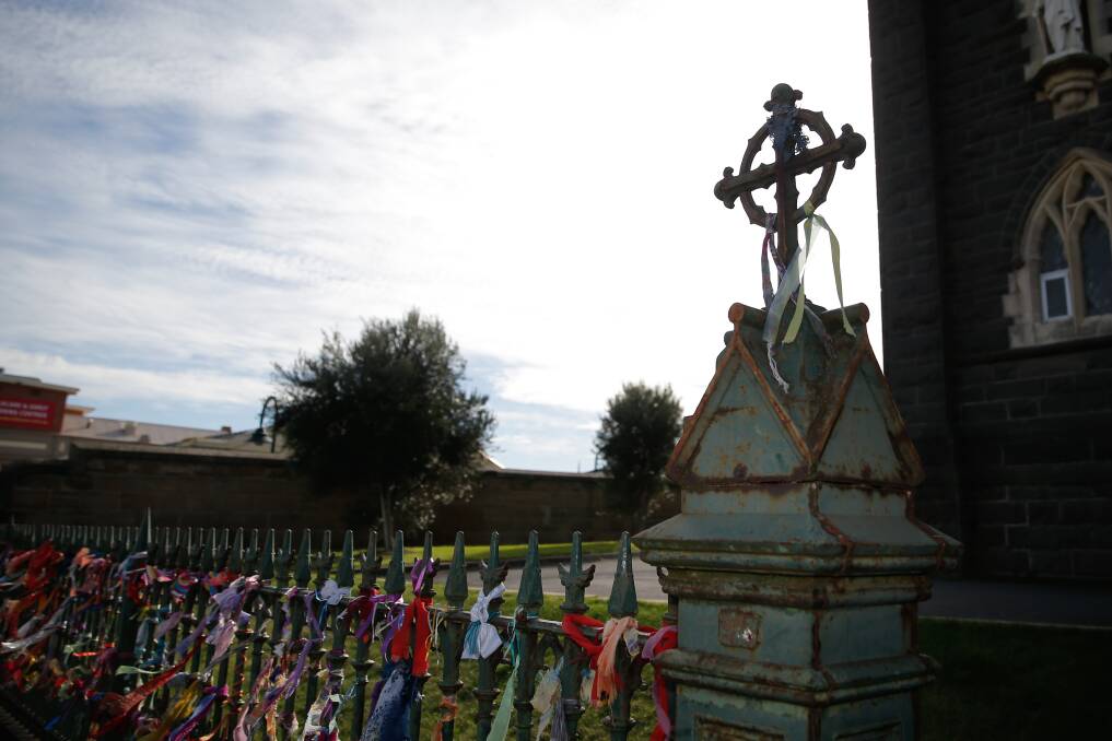 Long road: Ribbons tied to fences outside Catholic Churches are a sign of support for survivors of cleric abuse. Picture: Mark Witte