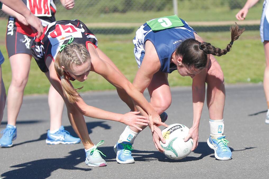 DRAW: Koroit's Isabella Baker and Warrnambool's Sarah O'Keeffe fight for the ball during their match. Picture: Mark Witte