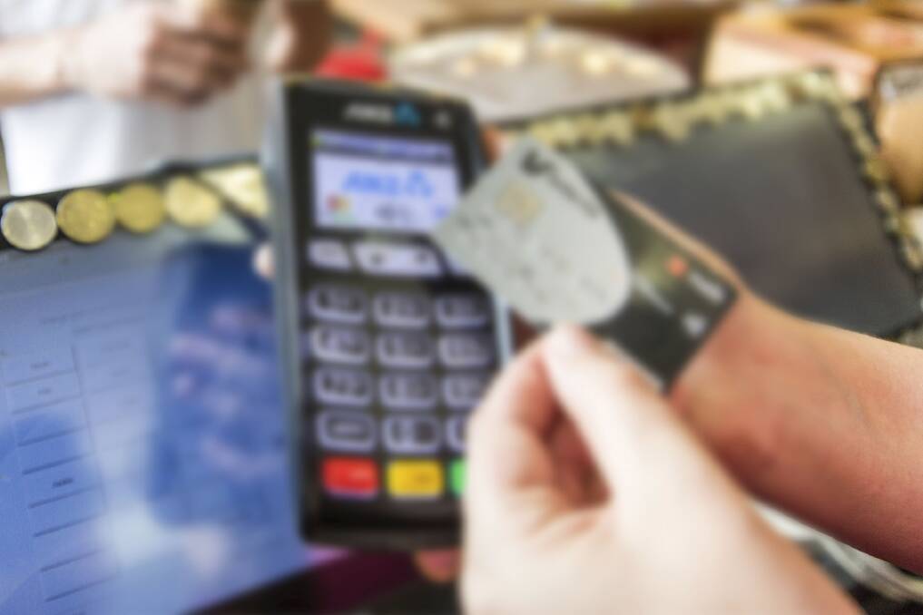 Generic blurred credit card paywave. Photo: Glenn Hunt
