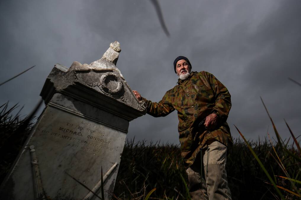FORGOTTEN: Marten Syme shows the abandoned, forgotten and overgrown Port Fairy cemetery, which is only accessible via a long walk on the beach. Picture: Morgan Hancock