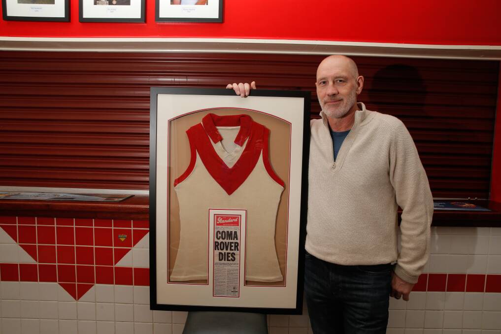 POIGNANT TRIBUTE: South Warrnambool's Jock O'Connor with Mick Daniel's jumper. His number six will be brought out of retirement. Picture: Mark Witte