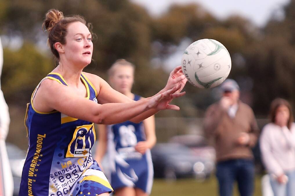 QUICK DISH: North Warrnambool Eagles' Grace Butters passes to a teammate against Warrnambool on Saturday. Picture: Mark Witte