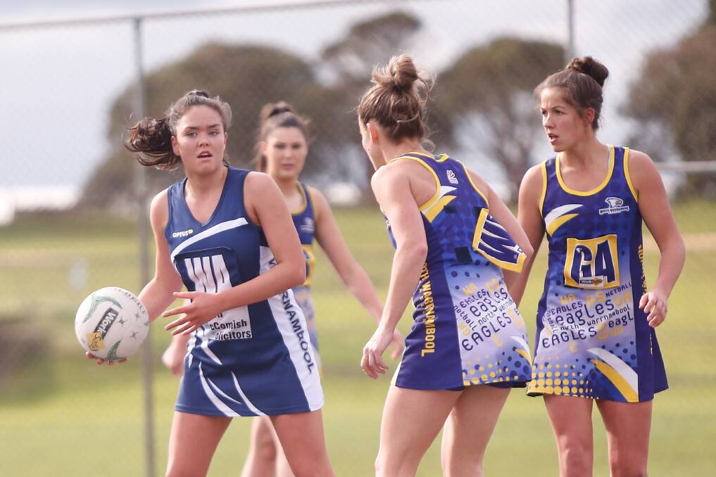 SEARCHING FOR OPTIONS: Warrnambool's Sarah Smith looks to pass the ball against North Warrnambool Eagles. Picture: Mark Witte