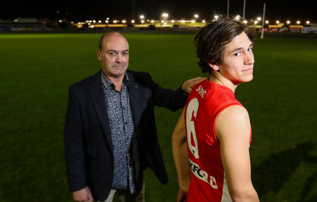 NEW ERA: Shane Daniel with EJ Harvey, who recieved his brother Mick's old number. Picture: Morgan Hancock
