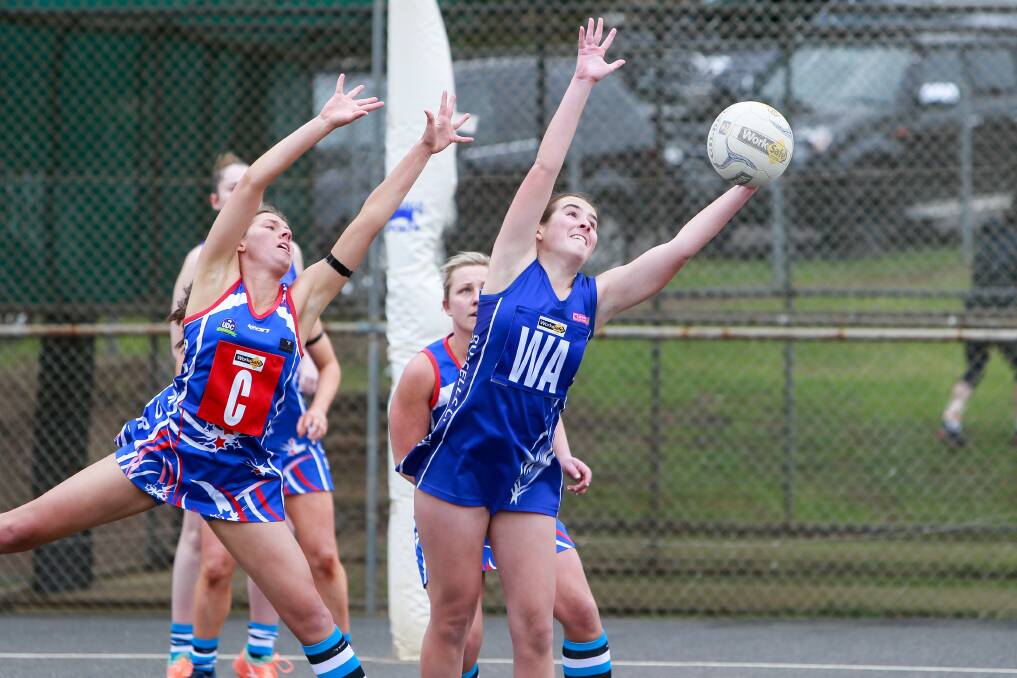 STRETCH: Panmure's Rachel Dickson and Russells Creek's Sophie Morton fly for the ball on Saturday. Picture: Anthony Brady