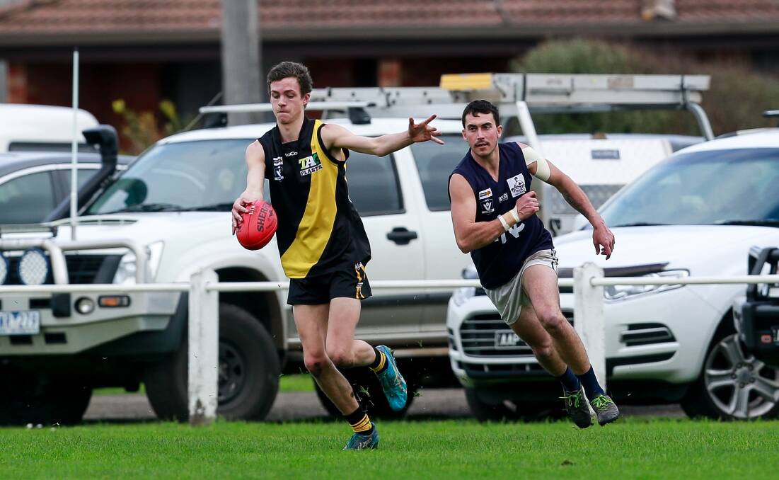 Out and running: Merrivale's Tyler Stephens runs from an opponent during his side's win over Nirranda. Picture: Anthony Brady