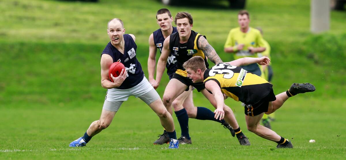 Ready to pounce: Merrivale's Jyron Neave about to tackle Nirranda's Brayden Harkness on Saturday. Picture: Anthony Brady