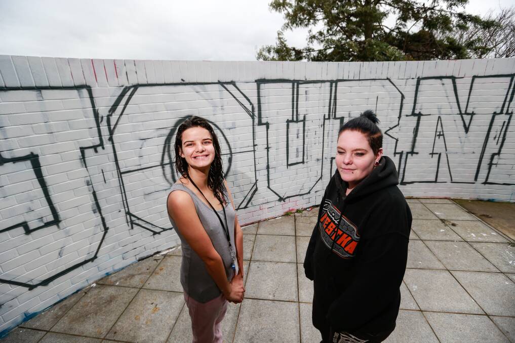 EARLY STAGES: Jasmine Anton and Sky Lovell helped contribute to a mural at The Foyer in Warrnambool. Picture: Anthony Brady
