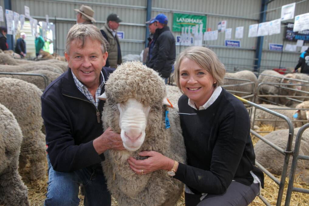 Top seller: Geoff and Bernadette Davidson, from Moorundie Poll Merino Stud in Keith SA, and the ram which scored the record price of $35,000 at the Sheepvention auction. Pictures: Rob Gunstone