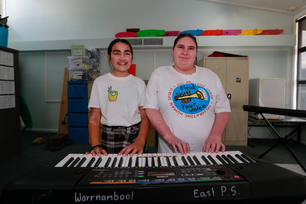 SOCIAL HARMONY: Warrnambool East Primary School student Hannah Greer and member of the all-abilities choir Kimberley Dempsey during the school's inclusion day. Picture: Anthony Brady