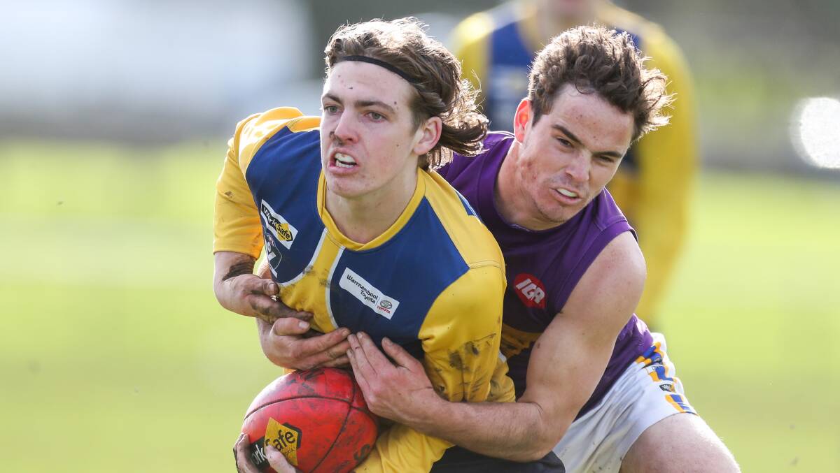 North Warrnambool Eagles' Bailey Jenkinson is wrapped up in a tackle. Picture: Morgan Hancock