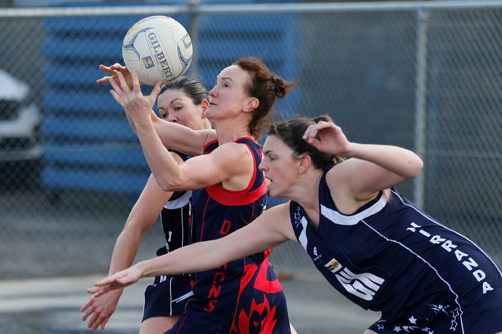 In dispute: Nirranda players Cloe Marr and Lisa Anders compete with a Timboon Demons opponent. Picture: Mark Witte