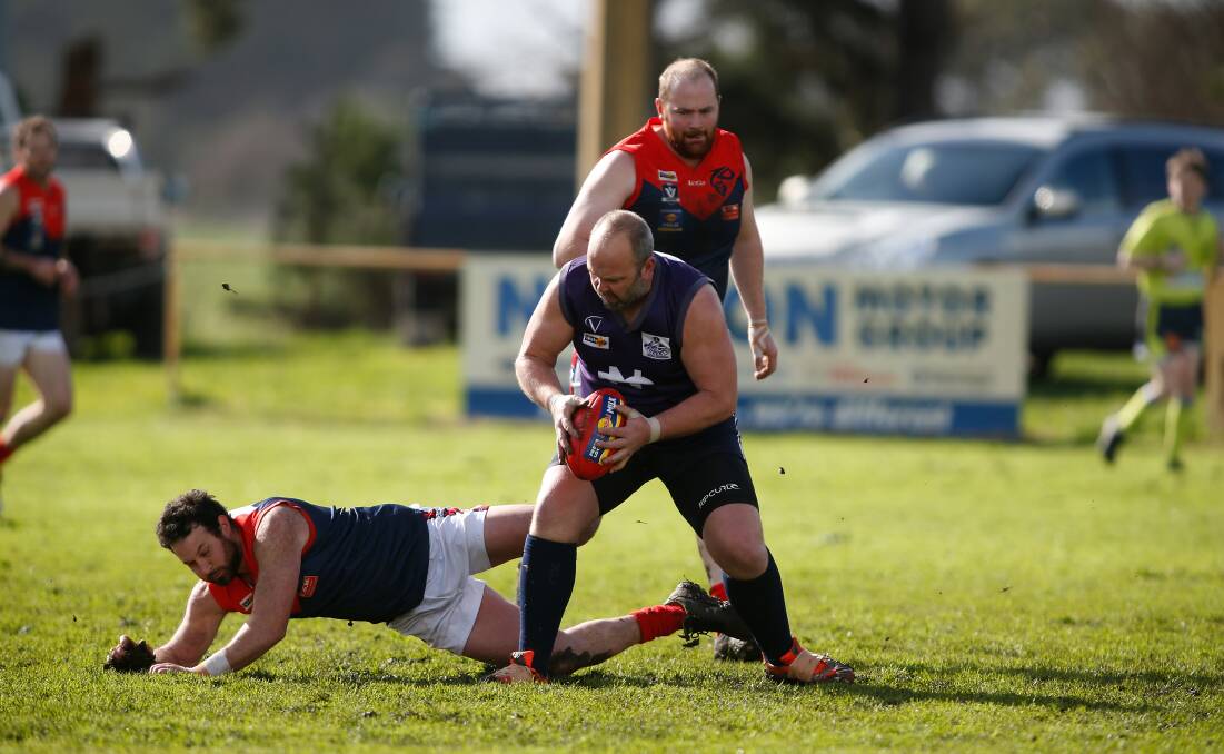 Holding his ground: Nirranda forward Gary Robinson marks the ball against Timboon Demons. Picture: Mark Witte