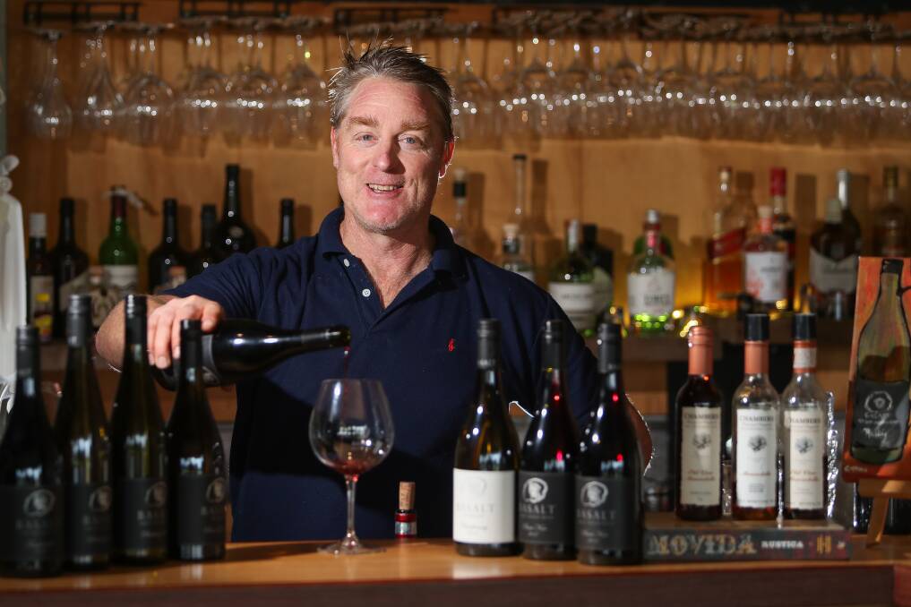 WHAT A WIN: Shane Clancey of Basalt Wines at Killarney pours out some of his award-winning wines at the cellar door and restaurant. Picture: Morgan Hancock