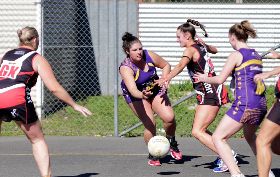 BATTLE: Port Fairy's Laura Addinsall and Koroit's Zahli Adams fight for possession during their game at Victoria Park on Saturday. Picture: Mark Witte