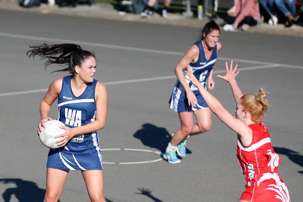 Important link: Warrnambool's Sarah Smith passes the ball. Picture: Mark Witte