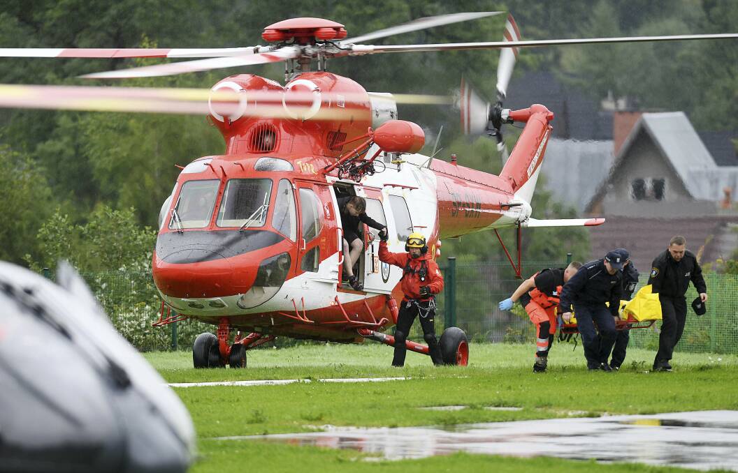 Rescue helicopter bring to hospital the first people injured by a lighting that struck in Poland's southern Tatra Mountains during a sudden thunderstorm.