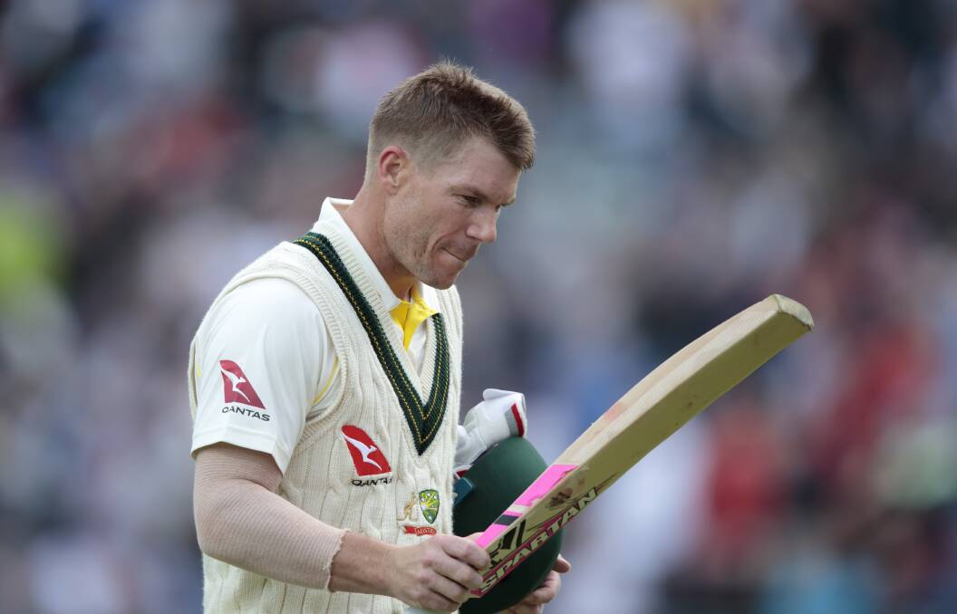 Australia's David Warner walks from the pitch after being caught by Jonny Bairstow for 61 off the bowling of England's Jofra Archer.