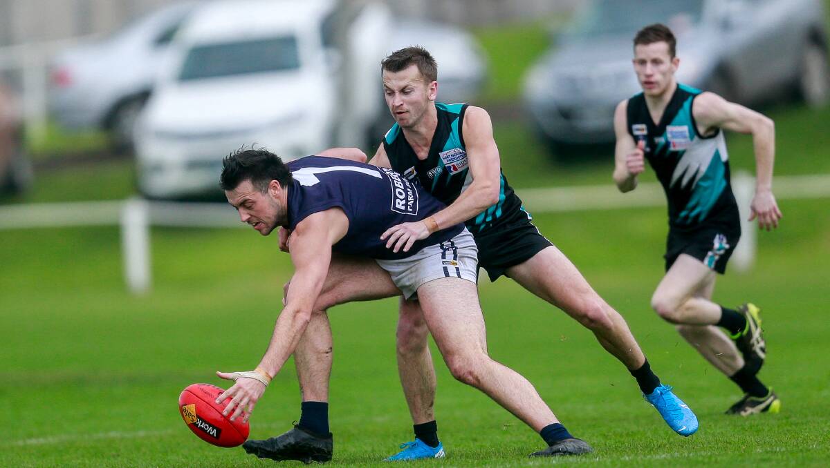Contact: Nirranda's Matthew Lloyd is tackled by Kolora-Noorat's Scott Judd in 2019. Contact training is not permitted under current COVID-19 measures. Picture: Anthony Brady