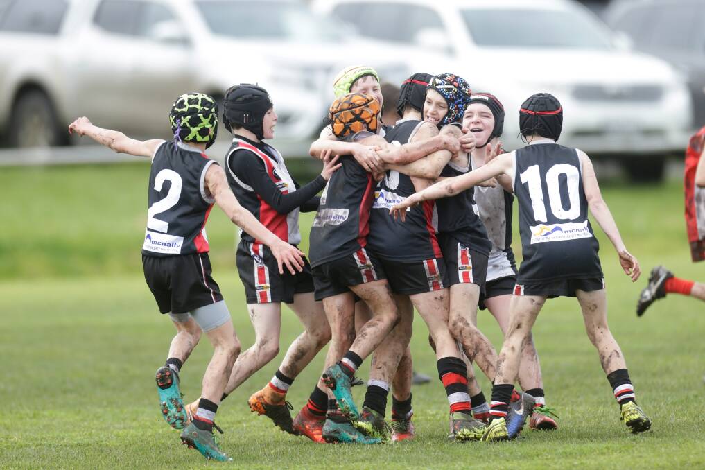 HAPPY TIMES: Koroit players celebrate kicking a goal during the Hampden league under grand final last year. Picture: Mark Witte
