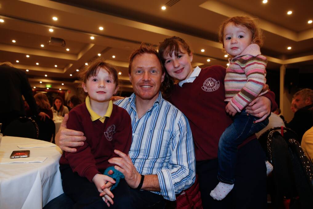 Proud dad: Warrnambool's Jayce Dufty won the Father of the Year award, with his daughters Pippa, 7, Grace, 11, and Harriet, aged 2. Picture: Mark Witte