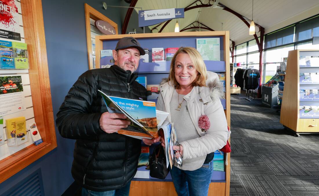 TOURISTS: Michael and Jo Gray from Sydney dropped into the Port Fairy Visitor Information Centre to check out what the town had to offer. Picture: Anthony Brady