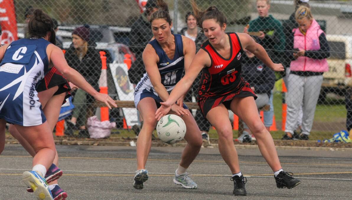 CRUNCH: Warrnambool's Emma Cust fights for the ball with Cobden's Emily Finch. Picture: Rob Gunstone