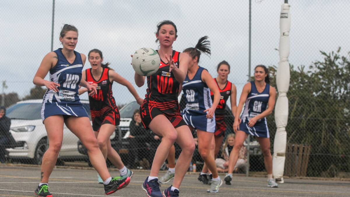 Athletic: Cobden's Amy Hammond takes the ball on the move during last year's semi-final against Warrnambool. Picture: Rob Gunstone