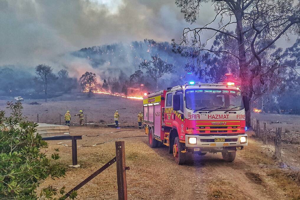 Firefighters from Fire and Rescue NSW, Station 302 Glen Innes as they attend to a bushfire in Tenterfield, NSW. 